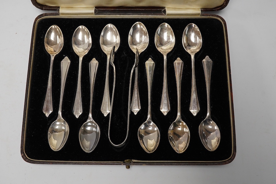 A 1960's silver Guernsey milk can, by Kenneth Tyler Key, height 16cm and two cased sets of spoons (one incomplete) including a pair of berry spoons by Thomas Eustace, Exeter, 1783. Condition - fair to good